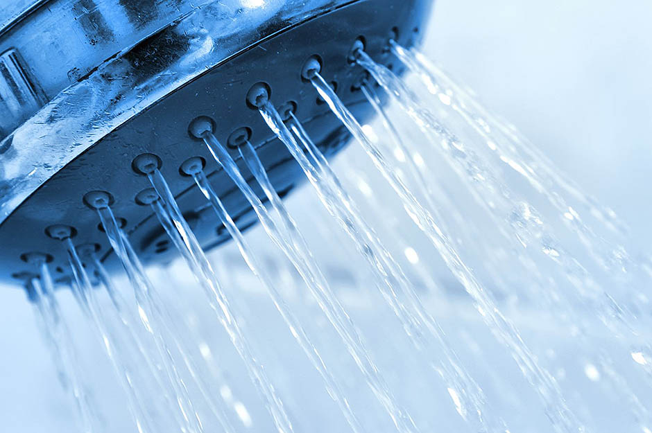 close up shower head with water